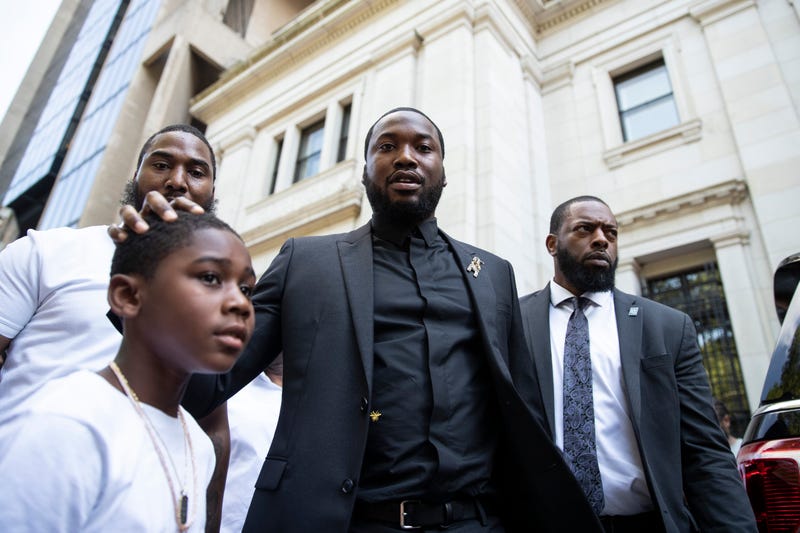 Rapper Meek Mill departs with his son Rihmeek “Papi” Williams after a hearing at a Pennsylvania appeals court in Philadelphia, Tuesday, July 16, 2019.