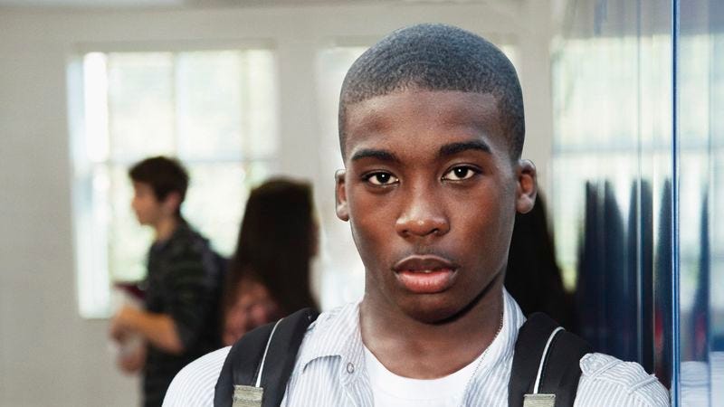 Classmates say Ombale, who once watched his tortured father beg for his life, is a “weird, quiet little dork.”