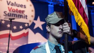 Boy holds U.S. flag at Values Voter Summit (Andrew Burton/Getty Images)