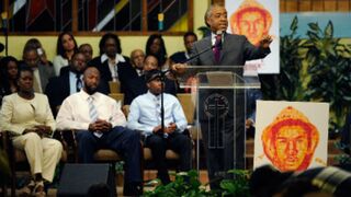 Trayvon Martin's parents and brother with the Rev. Al Sharptonat Trayvon rally (Earl Gibson III/WireImage/Getty Images)