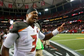 Jameis Winston of the Tampa Bay Buccaneers celebrates after beating the Atlanta Falcons in overtime at the Georgia Dome in Atlanta Nov. 1, 2015.Kevin C. Cox/Getty Images