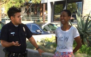 Danièle Watts with a Los Angeles police officer on Sept. 11, 2014, when she says she was unjustly harassedBRIAN JAMES LUCAS via Facebook