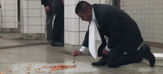 Guy vacuums a subway floor and eats dinner off of it in gross out ad