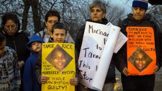 Protesters display sigs at Cudell Commons Park in Cleveland, Ohio, November 24, 2014 during a rally for Tamir Rice, a 12-year-old boy shot by police on November 23. Â JORDAN GONZALEZ/AFP/Getty Images