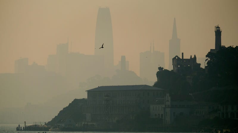 The San Francisco skyline is obscured by smoke and haze from wildfires behind Alcatraz Island Wednesday, Nov. 14, 2018, in San Francisco.