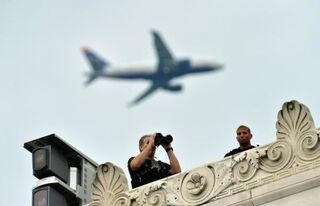 Member of Secret Service scan the area as President Barack Obama speaks during the Let Freedom Ring Commemoration and Call to Action to commemorate the 50th anniversary of the March on Washington at the Lincoln Memorial in Washington, D.C., Aug. 28, 2013.JEWEL SAMAD/AFP/Getty Images