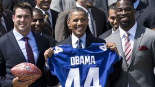 President Obama with Zak DeOssie (L) and Justin Tuck (Brendan Smialowski/AFP/Getty)