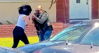 Illustration for article titled Video: US Marshal Rushes Woman Filming Him, Breaks, Kicks Camera