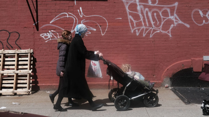 APRIL 10: People walk through an ultra-Orthodox Jewish community in Williamsburg on April 10, 2019 in New York City. As a measles epidemic continues to spread, New York City Mayor Bill de Blasio recently announced a state of emergency and mandated residents of the ultra-Orthodox Jewish community in Williamsburg at the center of the outbreak to get vaccinated for the viral disease. Those who choose not to will risk a $1,000 fine.