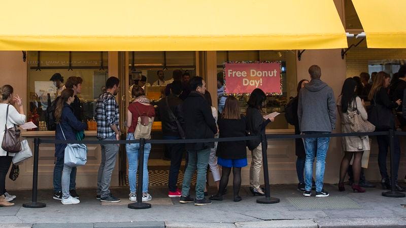 A line outside a bakery on Free Donut Day.