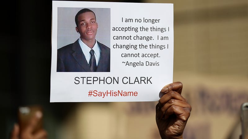 A protester holds a photo of Stephon Clark during a Black Lives Matter demonstration outside of Sacramento City Hall on March 22, 2018, in Sacramento, Calif. Hundreds of protesters staged a demonstration against the Sacramento Police Department after two officers shot and killed Clark, an unarmed black man, in the backyard of his grandmother’s house following a foot pursuit.