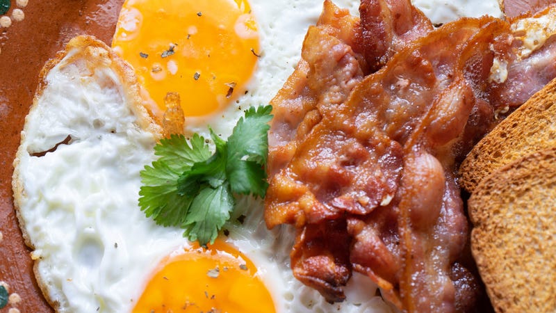 Illustration for article titled Bidding now open for 5-foot-long bacon couch