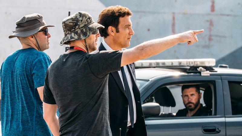 Neill Blompkamp (center) and Clive Owen (right) on the set of The Escape (Photo: BMW Films)