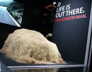 Illustration for article titled MINI Countryman Dons Ghillie Suit, Sniping Chinese Hipsters