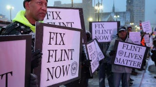 Demonstrators demand action from the Republican presidential candidates about the water crisis in Flint, Mich., outside the historic Fox Theater before the GOP presidential debate March 3, 2016, in Detroit.Chip Somodevilla/Getty Images