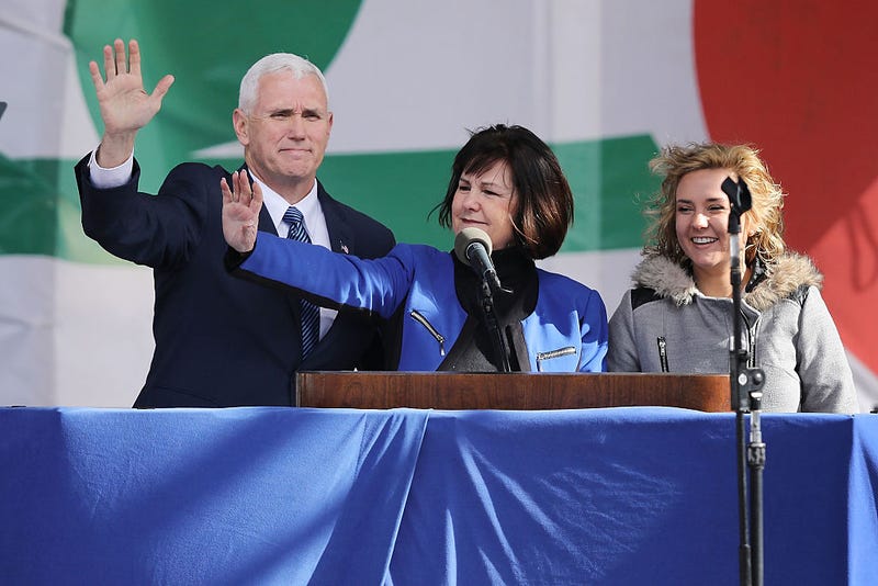 Mike Pence and some women. (Image via Getty)