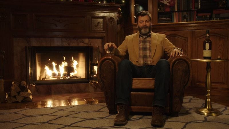 Illustration for article titled Here’s 45 minutes of Nick Offerman drinking whisky in front of a fire