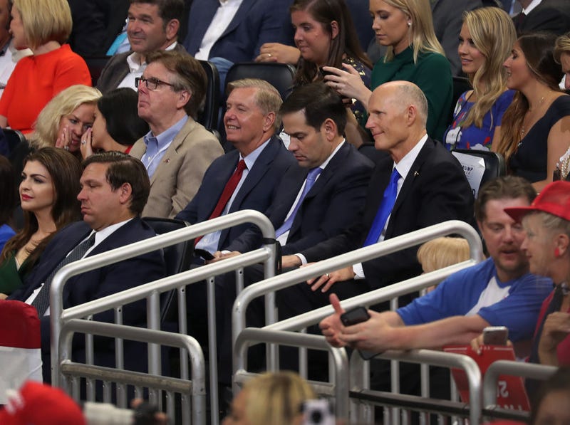 Florida Gov. Ron DeSantis (front row) Lindsey Graham (R-SC), Sen. Marco Rubio (R-FL) and Sen. Rick Scott (R-FL) listen as U.S. President Donald Trump announces his candidacy for a second presidential term on June 18, 2019 in Orlando, Florida.