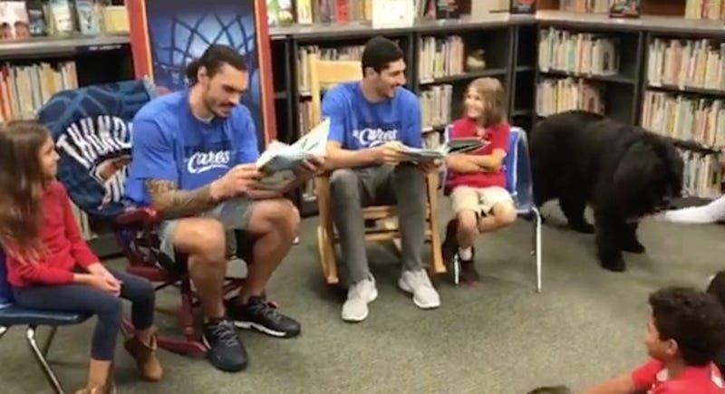 Illustration for article titled Steven Adams And Enes Kanter Met Some Dogs And Some Kids