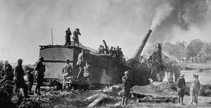 American troops of the 35th Coast Artillery firing 1,200 pound shells from an enormous 14 inch railway mounted gun at the opening of the Meuse-Argonne Offensive during World War I.