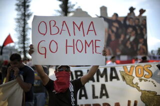 University students protest President Obama's Latin America visit.