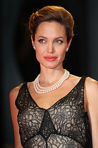Illustration for article titled Angelina Jolie Hints That She'll Never Marry Brad?