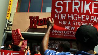 Fast-food workers demonstrating outside a Wendy's in New York (Spencer Platt/Getty Images)
