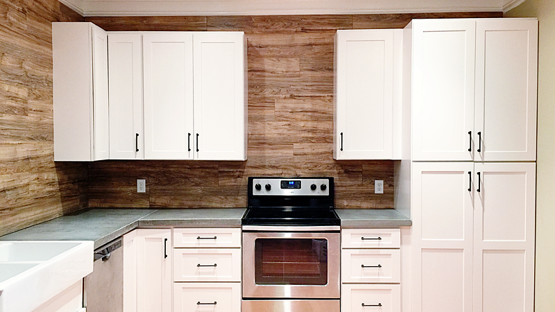 Use Laminate Flooring As A Durable, Easy To Clean Backsplash In Your
