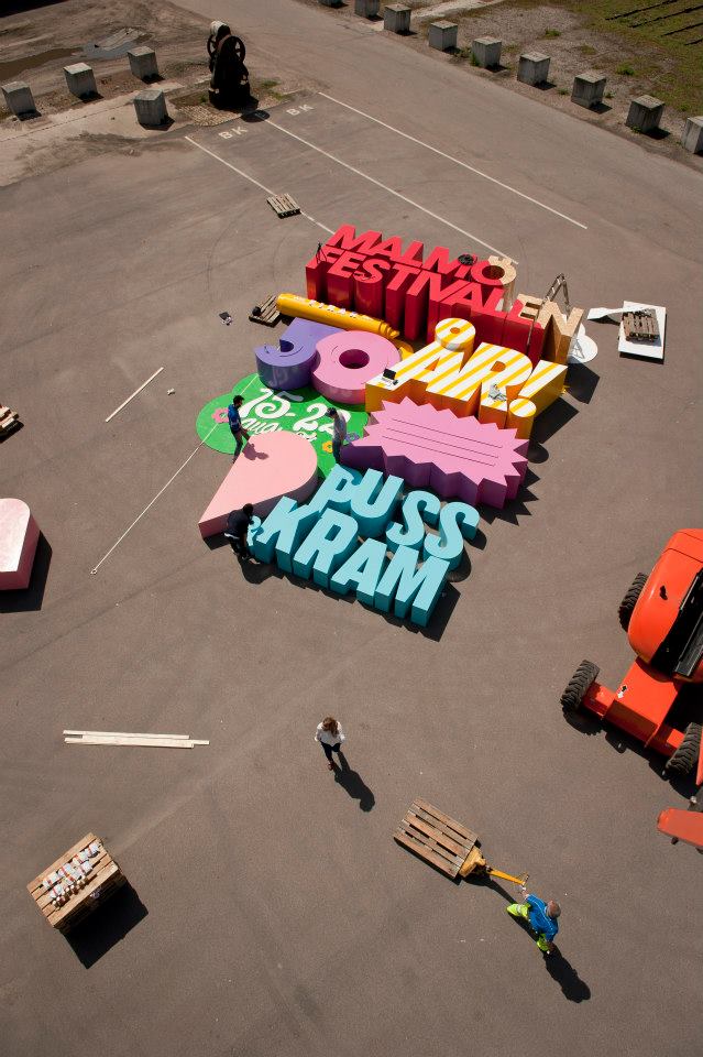 Cool 3D Poster Is Made With Letters So Big That They Can Crush A Human