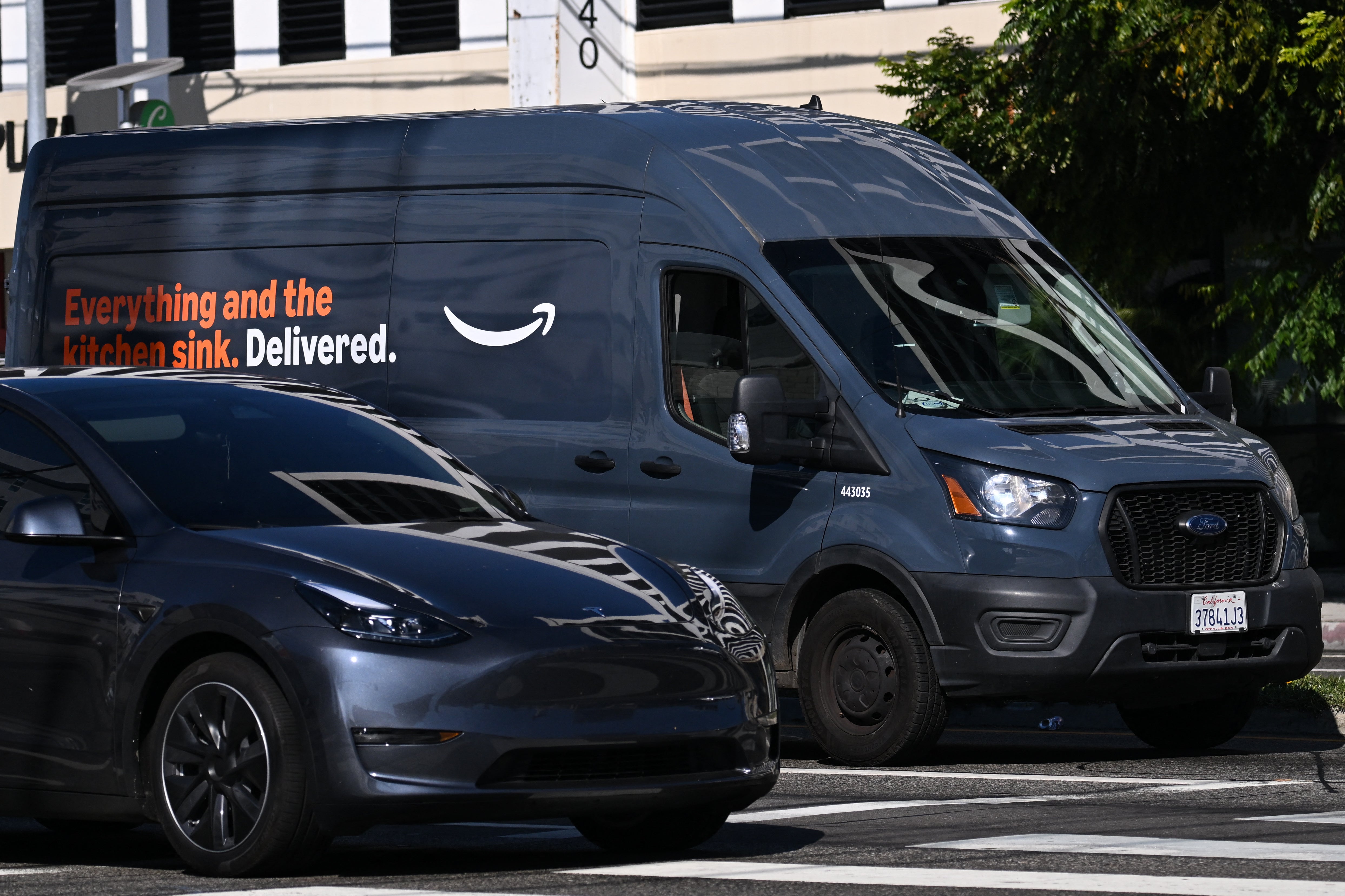 A Tesla and an Amazon van