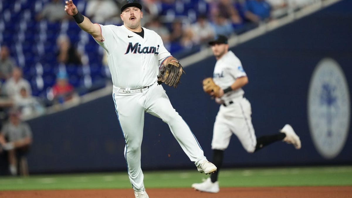 Miami Marlins' Jake Burger hits a walk off single to win the game during  the ninth inning of a baseball game against the New York Yankees, Sunday,  Aug. 13, 2023, in Miami.