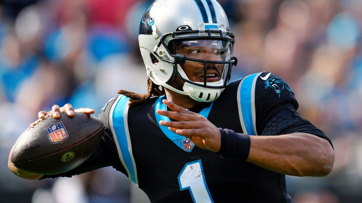 Cam Newton signs with Carolina Panthers. Will he start at QB?