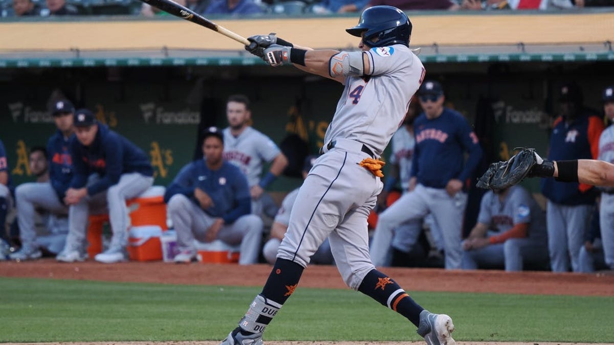 Houston Astros shortstop Mauricio Dubon steals second base in the