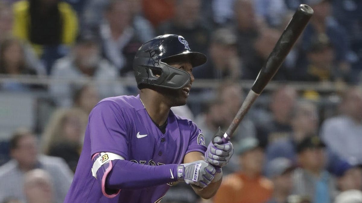 Jurickson Profar of the Colorado Rockies walks off the field