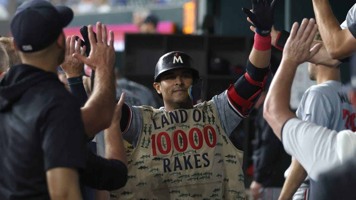 Minnesota Twins first baseman Donovan Solano, left, New York