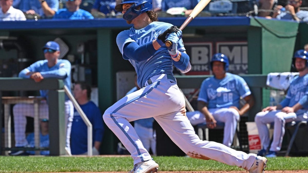 Kansas City Royals shortstop Bobby Witt Jr. throws to first base