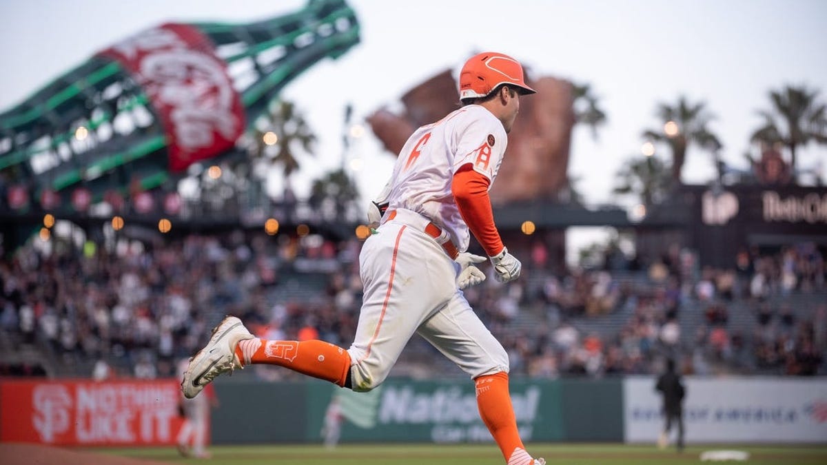 Mitch Haniger of the San Francisco Giants rounds the bases after