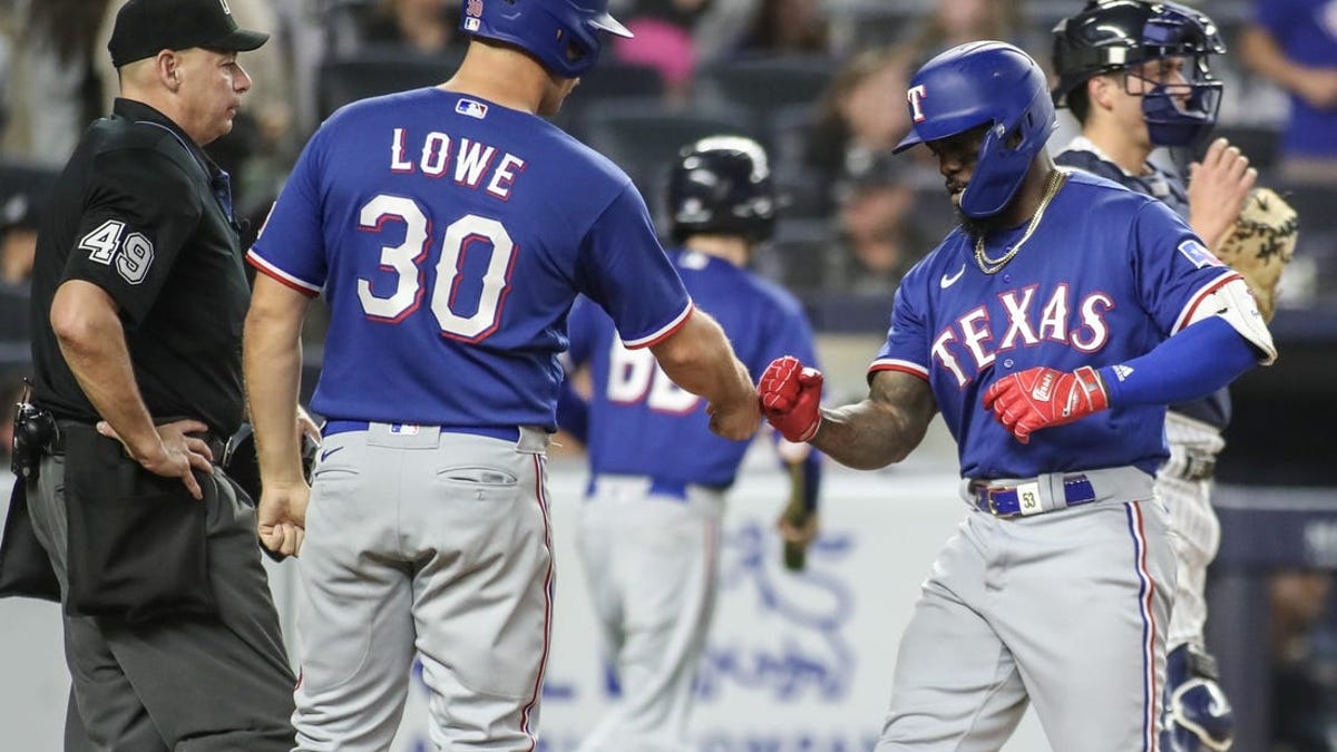 Texas Rangers' Ezequiel Duran breaks his bat on a groundout during