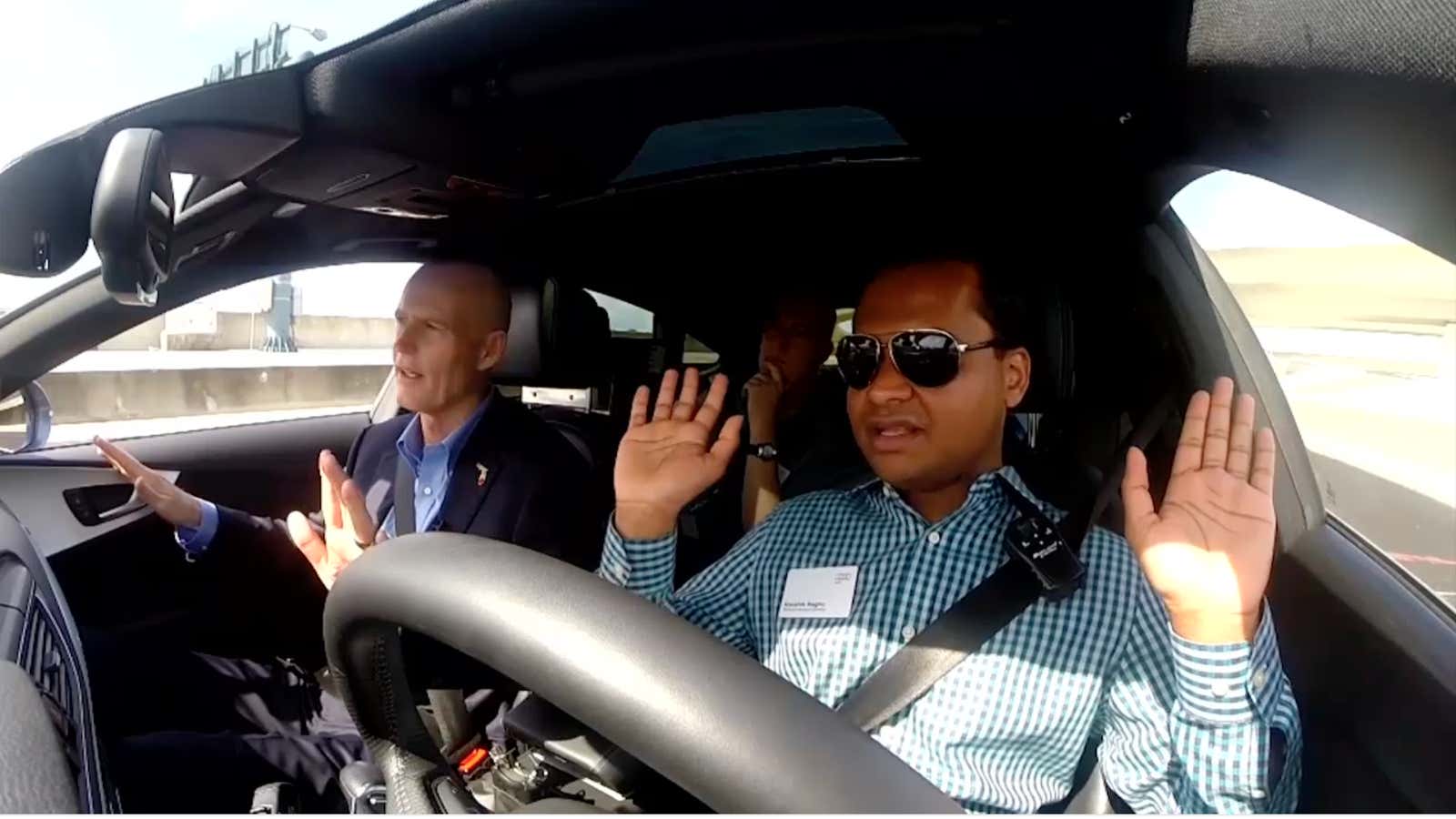 Florida’s Governor (L) is not so hands off about autonomous vehicles in his state.