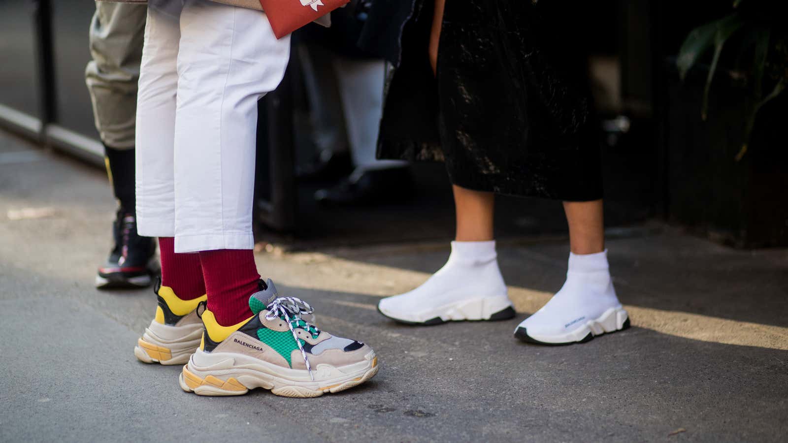 At left, the Balenciaga Triple S, which currently retails for $950.