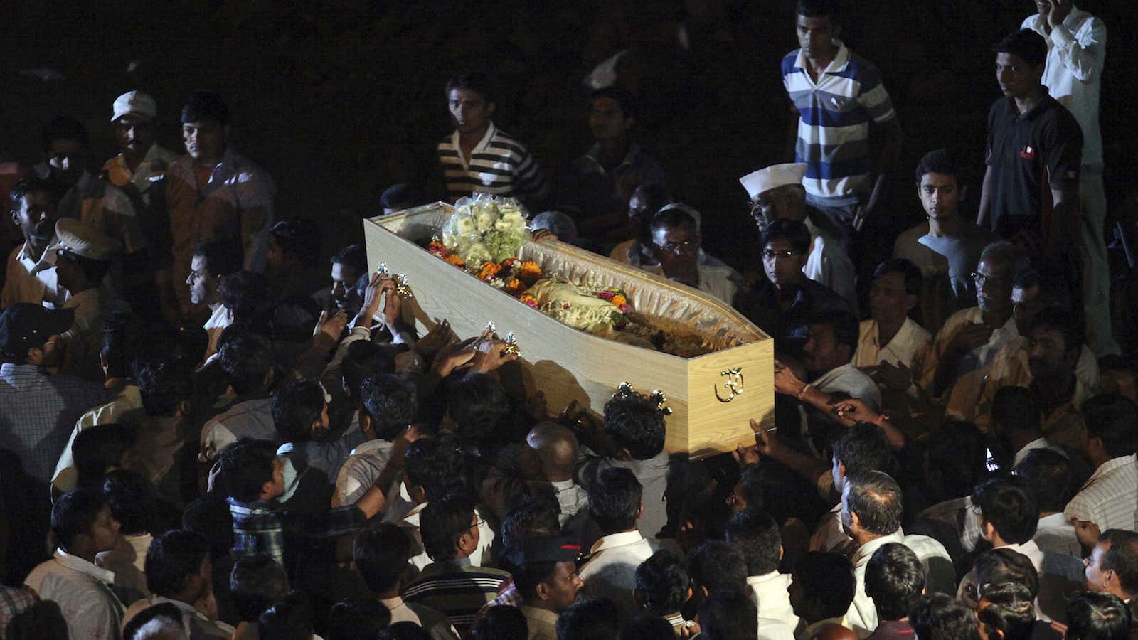 Relatives carry the body of Anuj Bidve outside his house during his funeral in Pune, about 190km (118 miles) from Mumbai, January 7, 2012. Bidve,…