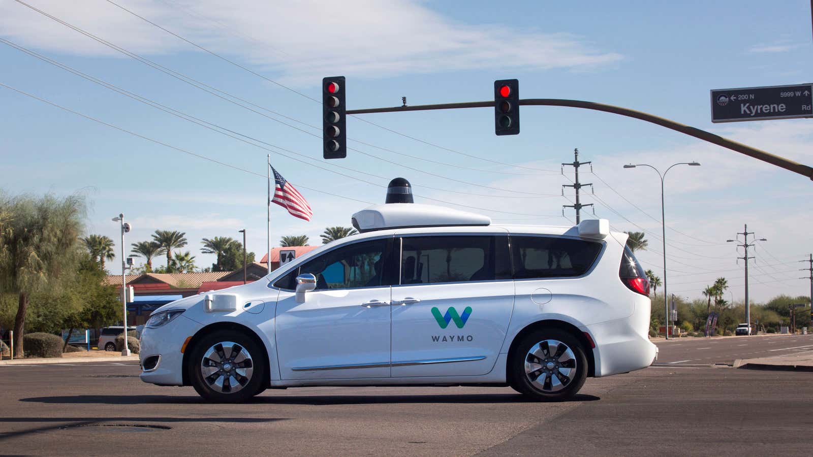 A Waymo self-driving car driving through an intersection in Chandler, Arizona.