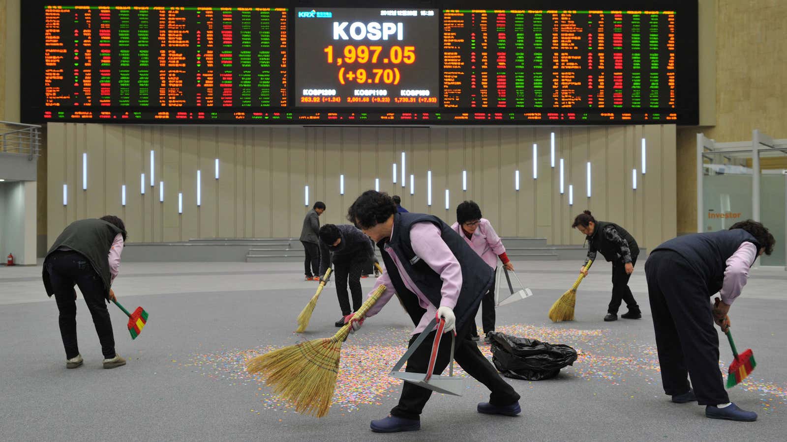 Sweeping confetti after the last trading day of the year in Seoul