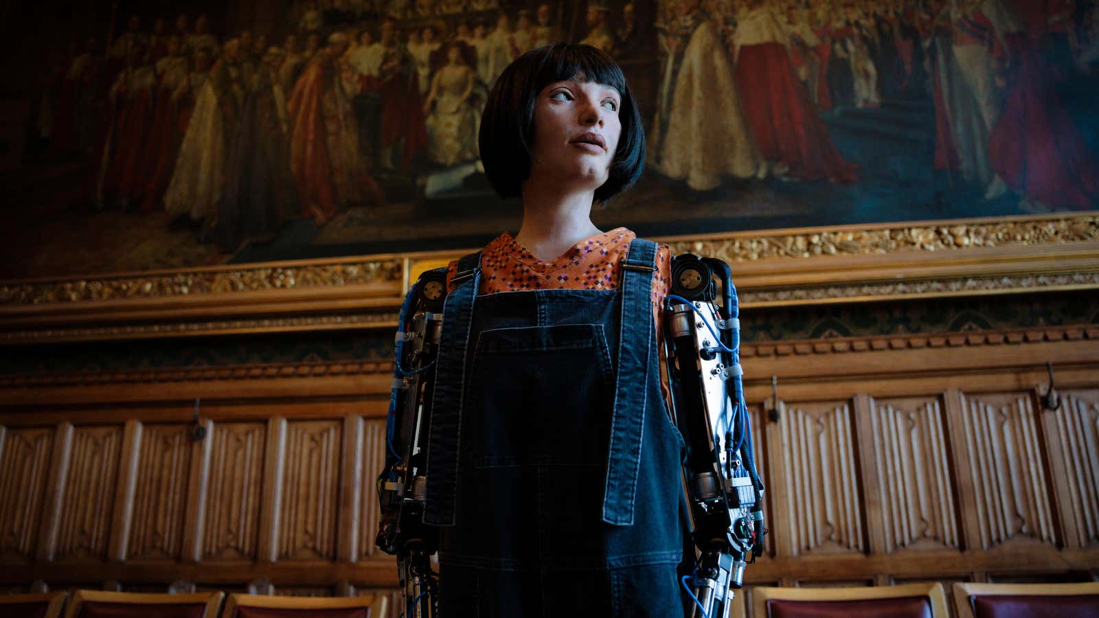 The Ai-Da robot stands inside a meeting room in the House of Lords in London.