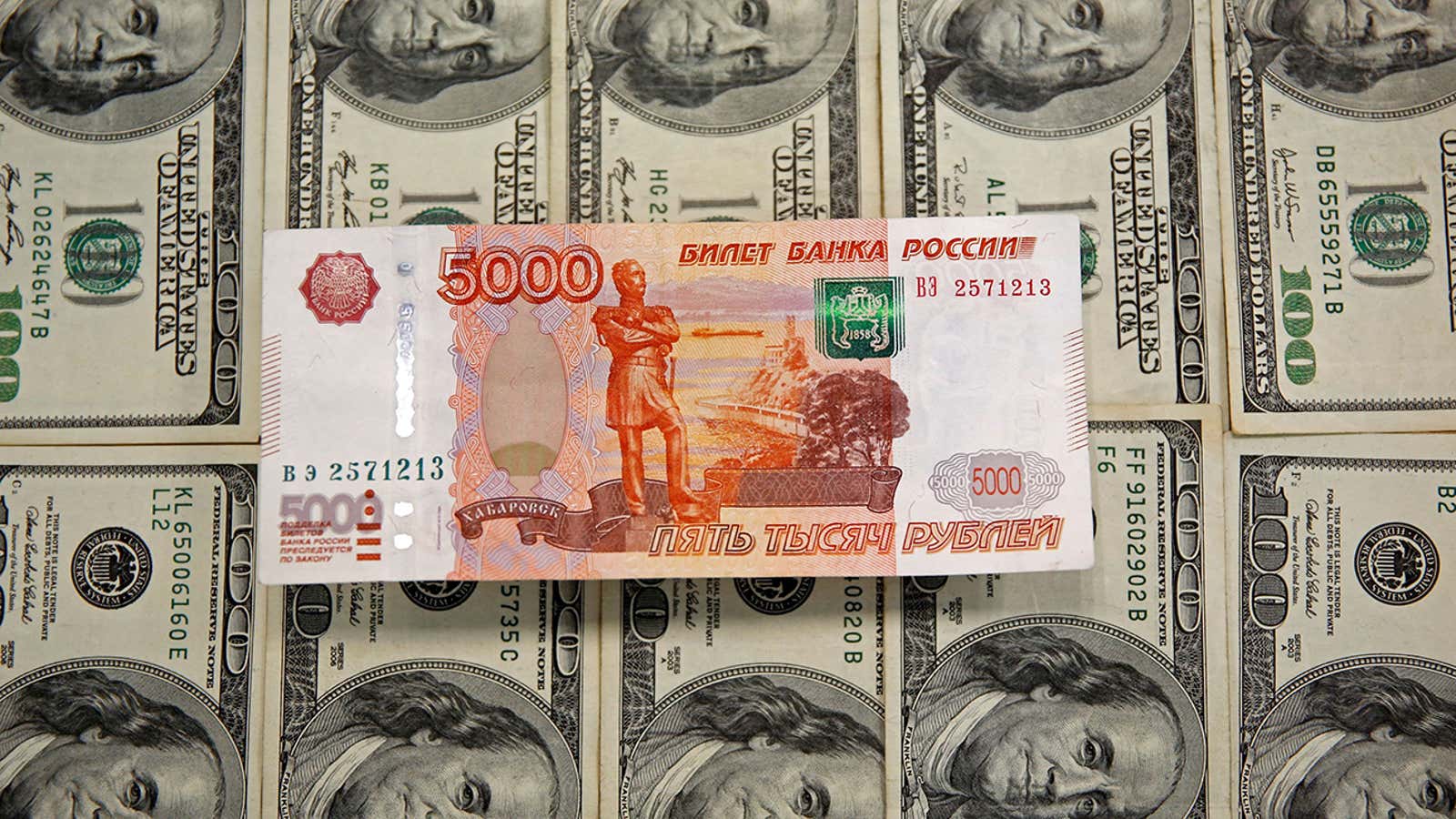 US dollar and Russian ruble banknotes.