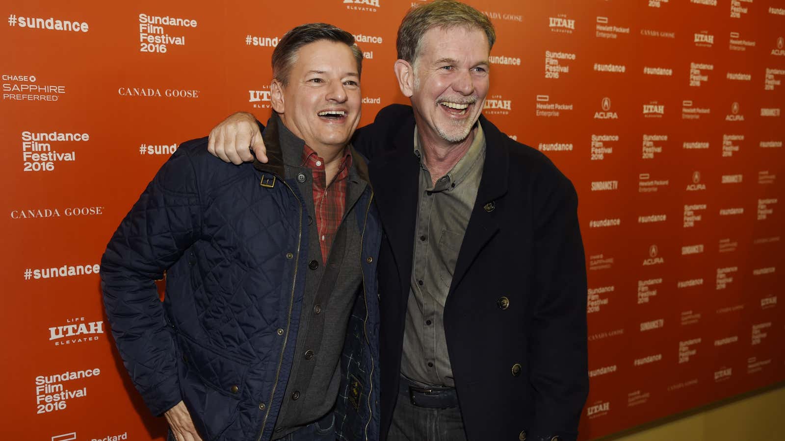 Netflix executives Reed Hastings and Ted Sarandos pose for a photo at Sundance.