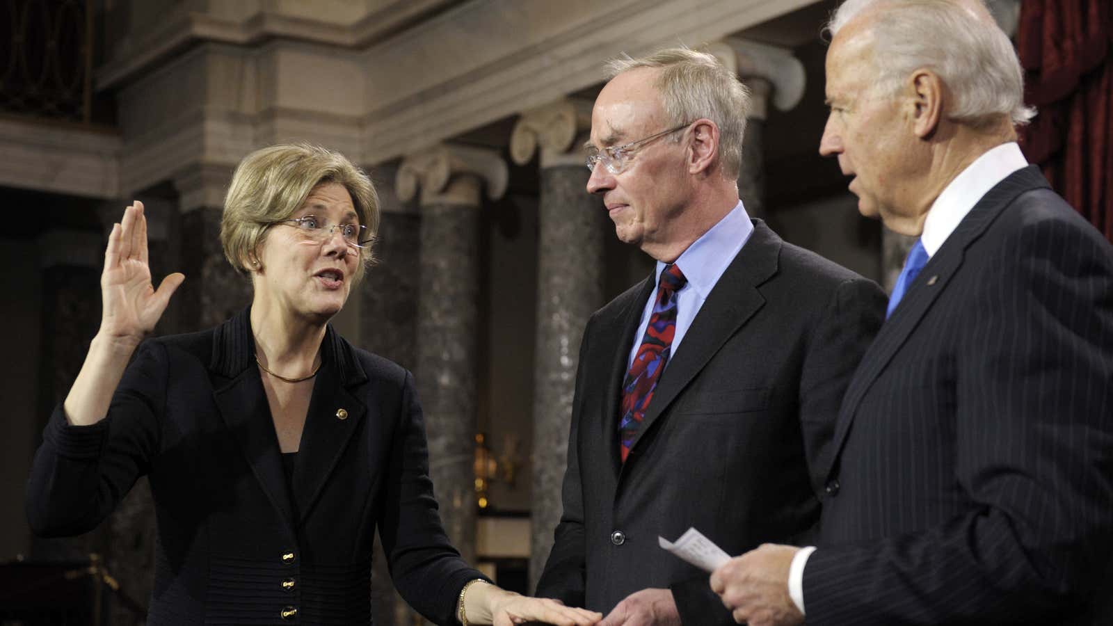 Warren is sworn in as a senator by vice president Biden in 2013.