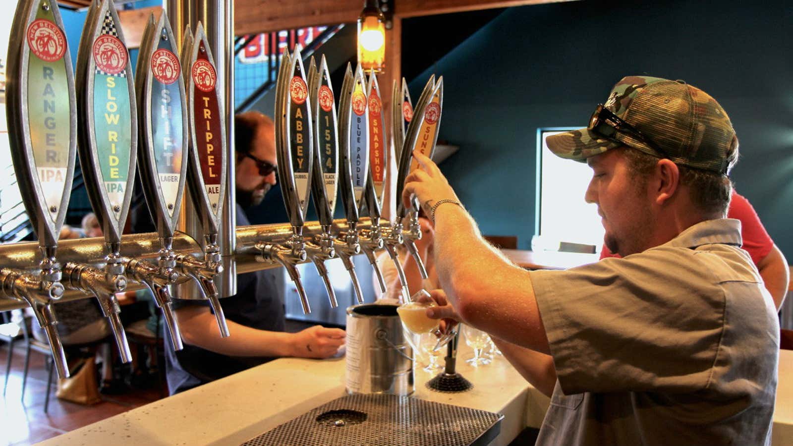 A bartender pours at the New Belgium brewery.