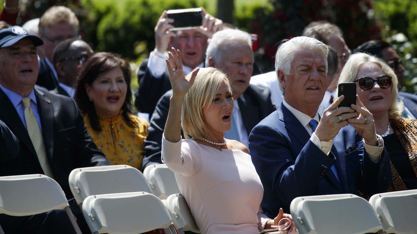 Paula White-Cain gestures in the audience in the Rose Garden before delivering the final prayer.