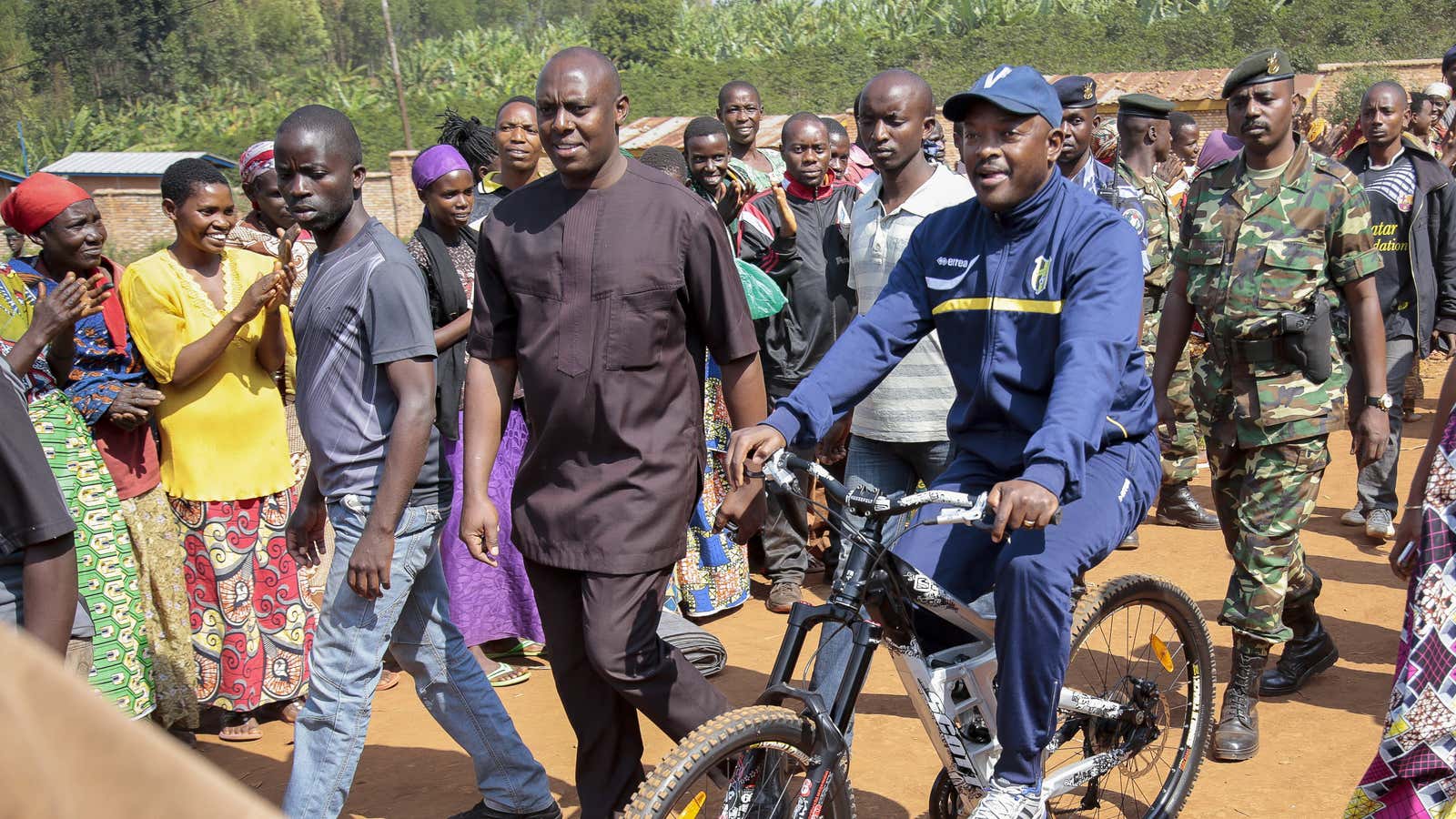 Burundi’s Nkurunziza arrives by bicycle to cast his vote in his home province, Ngozi, in Burundi.